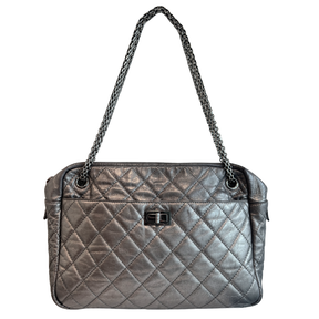 Front of Chanel Quilted Calfskin Leather Medium Reissue Camera Bag on a white background. 