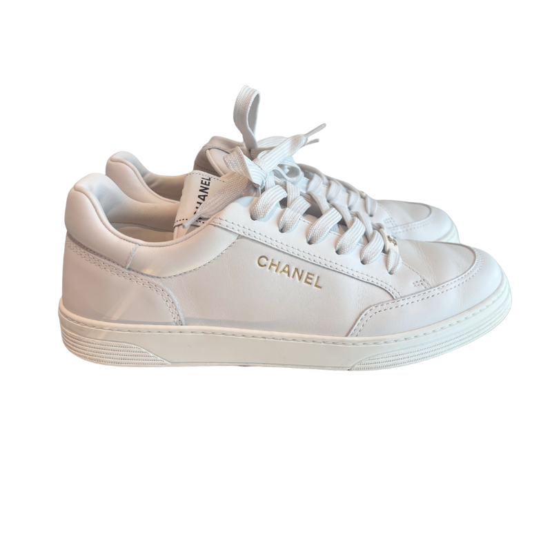 Side View of Chanel White Leather Shoes on White Background. 