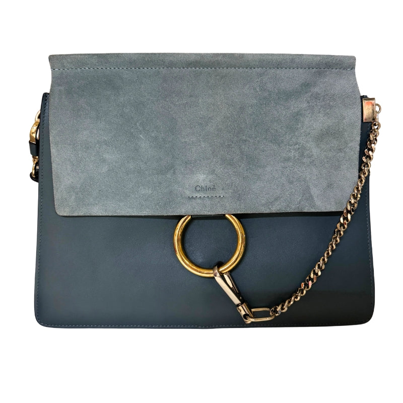 Chloe Faye Leather Shoulder Bag&nbsp;

Blue Leather&nbsp;

Multitonal Hardware

Suede Trim&nbsp;

Single Adjustable Shoulder Strap&nbsp;

Chain-Link Accents

Suede Lining&nbsp;