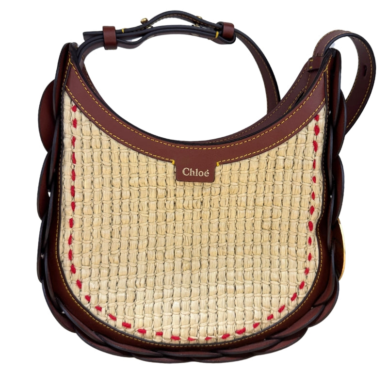 Chloe Raffia Darryl Hobo&nbsp;

Brown Calfskin Leather&nbsp;

Raffia

Looping Leather Shoulder Strap

Gold-Toned Ring&nbsp;

Beige Fabric Interior&nbsp;