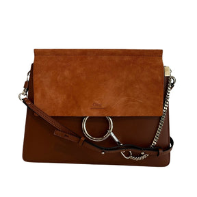 Chloe Faye Leather Shoulder Bag&nbsp;

Tan Leather&nbsp;

Multitonal Hardware

Suede Trim&nbsp;

Single Adjustable Shoulder Strap&nbsp;

Chain-Link Accents

Suede Lining&nbsp;