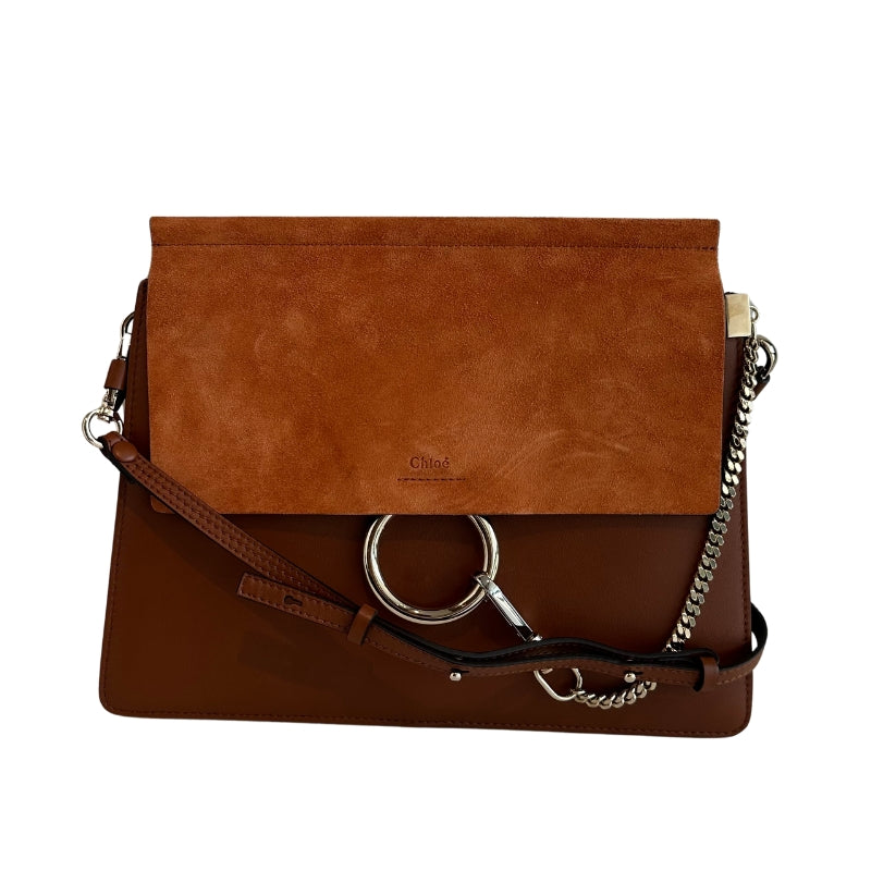 Chloe Faye Leather Shoulder Bag&nbsp;

Tan Leather&nbsp;

Multitonal Hardware

Suede Trim&nbsp;

Single Adjustable Shoulder Strap&nbsp;

Chain-Link Accents

Suede Lining&nbsp;