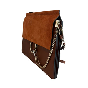Chloe Faye Leather Shoulder Bag&nbsp;

Tan Leather&nbsp;

Multitonal Hardware

Suede Trim&nbsp;

Single Adjustable Shoulder Strap&nbsp;

Chain-Link Accents

Suede Lining&nbsp;