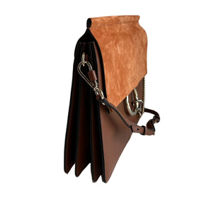 Chloe Faye Leather Shoulder Bag&nbsp;

Tan Leather&nbsp;

Multitonal Hardware

Suede Trim&nbsp;

Single Adjustable Shoulder Strap&nbsp;

Chain-Link Accents

Suede Lining&nbsp;