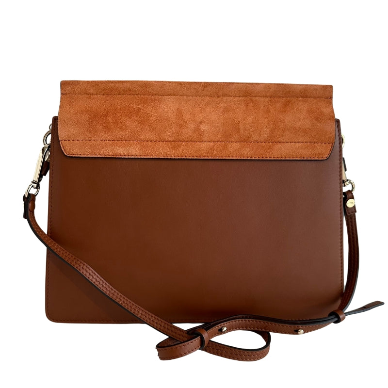 Chloe Faye Leather Shoulder Bag&nbsp;

Tan Leather&nbsp;

Multitonal Hardware

Suede Trim&nbsp;

Single Adjustable Shoulder Strap&nbsp;

Chain-Link Accents

Suede Lining&nbsp;