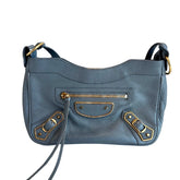 Balenciaga Motocross Crossbody&nbsp;

Blue Leather&nbsp;

Silver-Toned Hardware&nbsp;

Single Shoulder Strap

Single Exterior Pocket&nbsp;

Canvas Lining&nbsp;

Dual Interior Pockets&nbsp;

Zip Closure at Top&nbsp;