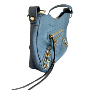 Balenciaga Motocross Crossbody&nbsp;

Blue Leather&nbsp;

Silver-Toned Hardware&nbsp;

Single Shoulder Strap

Single Exterior Pocket&nbsp;

Canvas Lining&nbsp;

Dual Interior Pockets&nbsp;

Zip Closure at Top&nbsp;