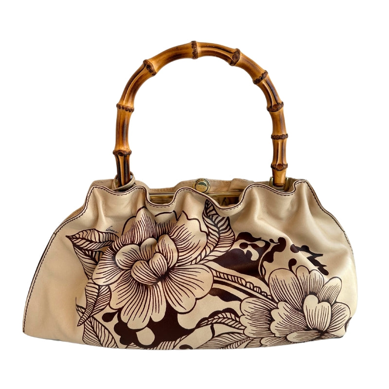 Gucci Floral Tattoo Bamboo Bag

Vintage

Neutrals Leather&nbsp;

Floral Print

Gold-Toned Hardware

Floral Print&nbsp;

Bamboo Handle&nbsp;

Push Lock Closure&nbsp;