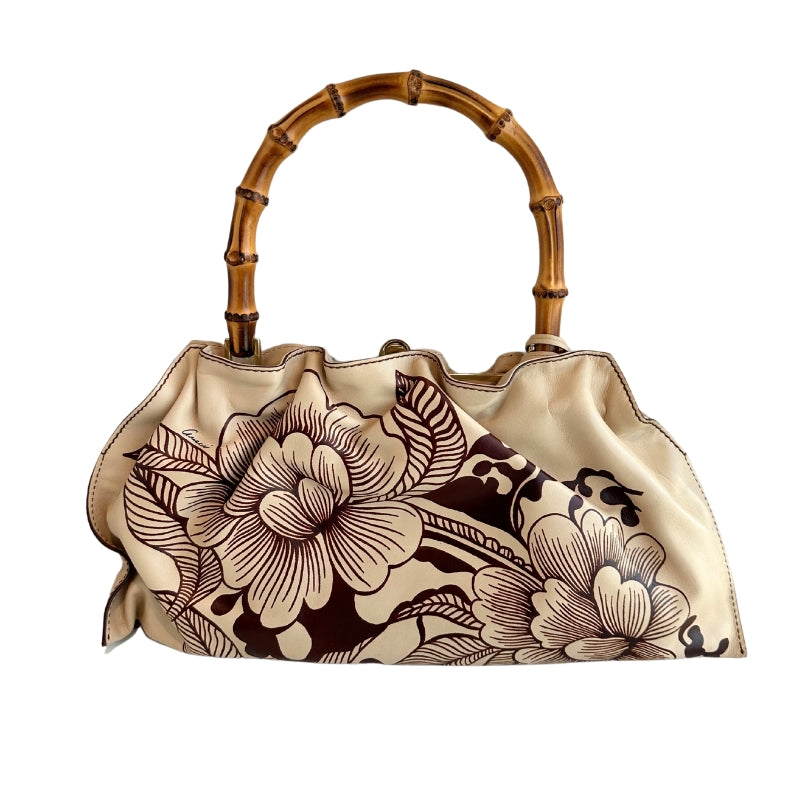 Gucci Floral Tattoo Bamboo Bag

Vintage

Neutrals Leather&nbsp;

Floral Print

Gold-Toned Hardware

Floral Print&nbsp;

Bamboo Handle&nbsp;

Push Lock Closure&nbsp;