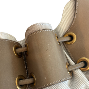 Close Up of Wear on Burberry Mega Nova Warrior Hobo Bag on a White Background. 