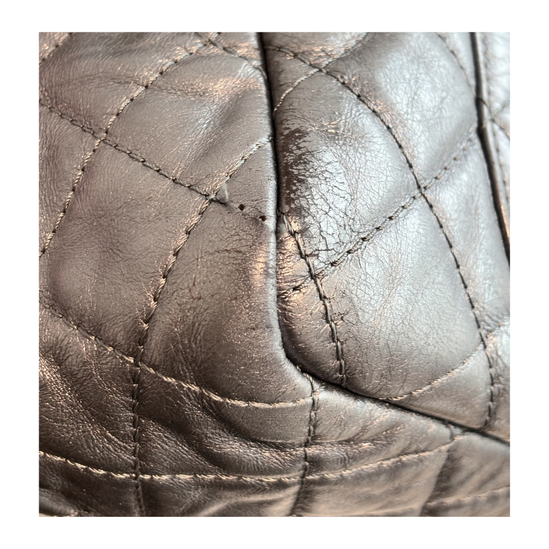 Close Up of Wear on Silver Chanel Bag.
