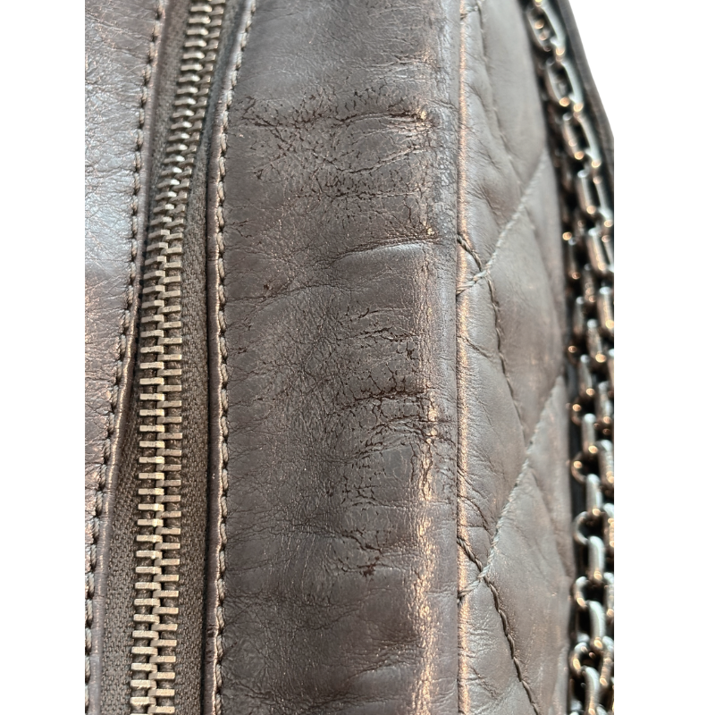 Close Up of Wear on Silver Chanel Bag.