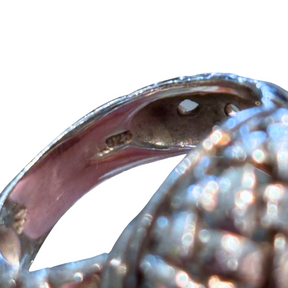 Close up of Slane Sterling Silver Woven Cocktail Ring on a white background. 