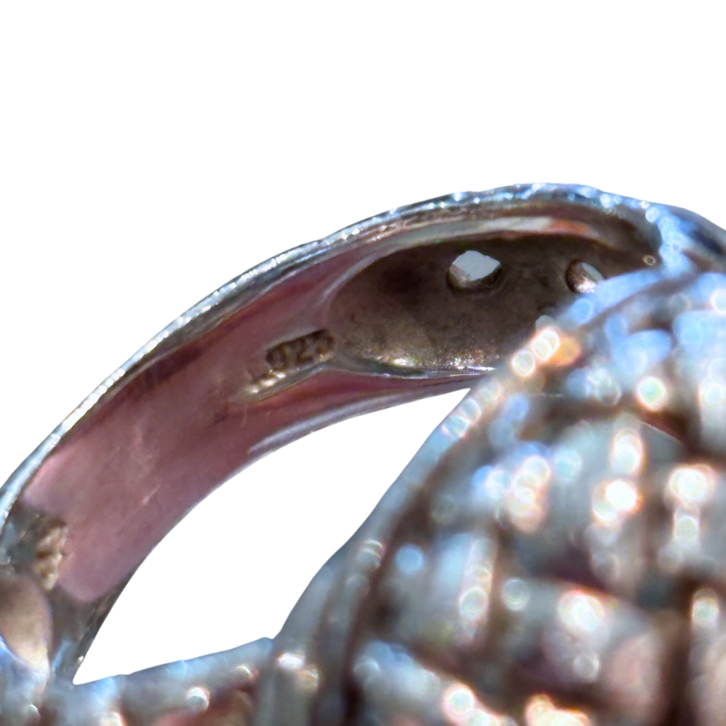 Close up of Slane Sterling Silver Woven Cocktail Ring on a white background. 