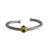 David Yurman Renaissance Cable Bracelet with gold accents and blue and green stones on a white background. 