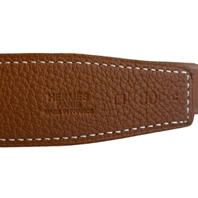 Details on Hermes H Buckle Reversible Belt on a White Background. 