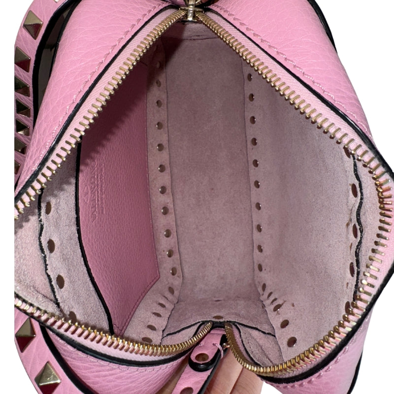 Valentino RockStud Bag&nbsp;

Pink Leather

Camera Crossbody Bag

Suede Interior&nbsp;

Pyramid Stud Detailing&nbsp;

Silver-Toned Hardware