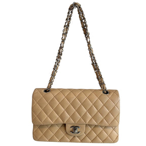 Chanel Classic Double Flap&nbsp;

Neutral Leather&nbsp;

Gold-Toned Hardware

Chain-Link Shoulder Strap

Single Exterior Pocket&nbsp;

Turn Lock Closure&nbsp;

Dust Bag and Box Included&nbsp;