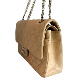 Chanel Classic Double Flap&nbsp;

Neutral Leather&nbsp;

Gold-Toned Hardware

Chain-Link Shoulder Strap

Single Exterior Pocket&nbsp;

Turn Lock Closure&nbsp;

Dust Bag and Box Included&nbsp;