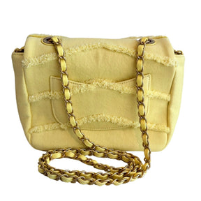 Chanel Coco Denim Flap Bag&nbsp;

Chanel Shoulder Bag

Yellow&nbsp;

Interlocking CC Logo&nbsp;

Gold-Toned Hardware

Single Exterior Pocket&nbsp;