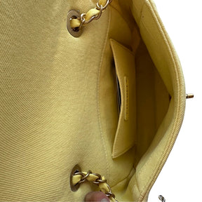 Chanel Coco Denim Flap Bag&nbsp;

Chanel Shoulder Bag

Yellow&nbsp;

Interlocking CC Logo&nbsp;

Gold-Toned Hardware

Single Exterior Pocket&nbsp;