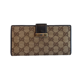 Front of Brown Gucci Canvas Icon Bar Monogram Flap Wallet on a White Background. 