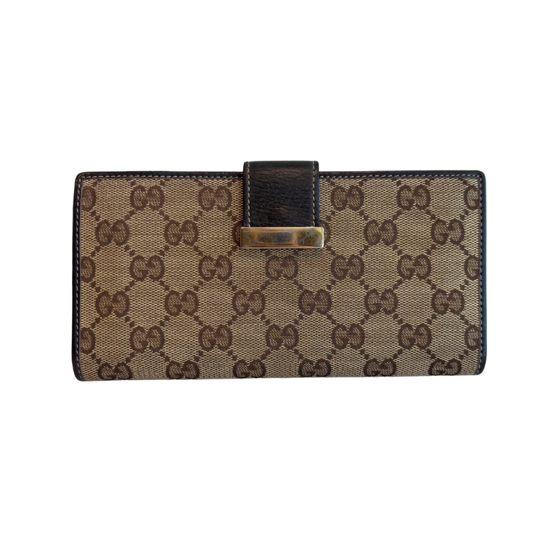 Front of Brown Gucci Canvas Icon Bar Monogram Flap Wallet on a White Background. 