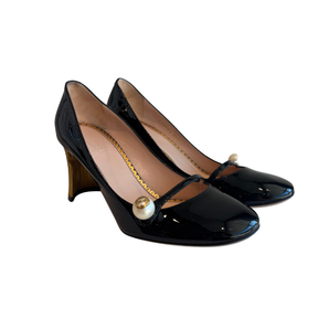 Side View of Gucci Patent Leather Crystal Pearl Embellished Mary Jane Heels on a White Background.