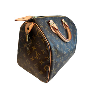 Louis Vuitton Speedy Mono&nbsp;

Louis Vuitton Top Handle Bag

Brown Coated Canvas

Brass Hardware

Leather Trim&nbsp;

Rolled Handles&nbsp;