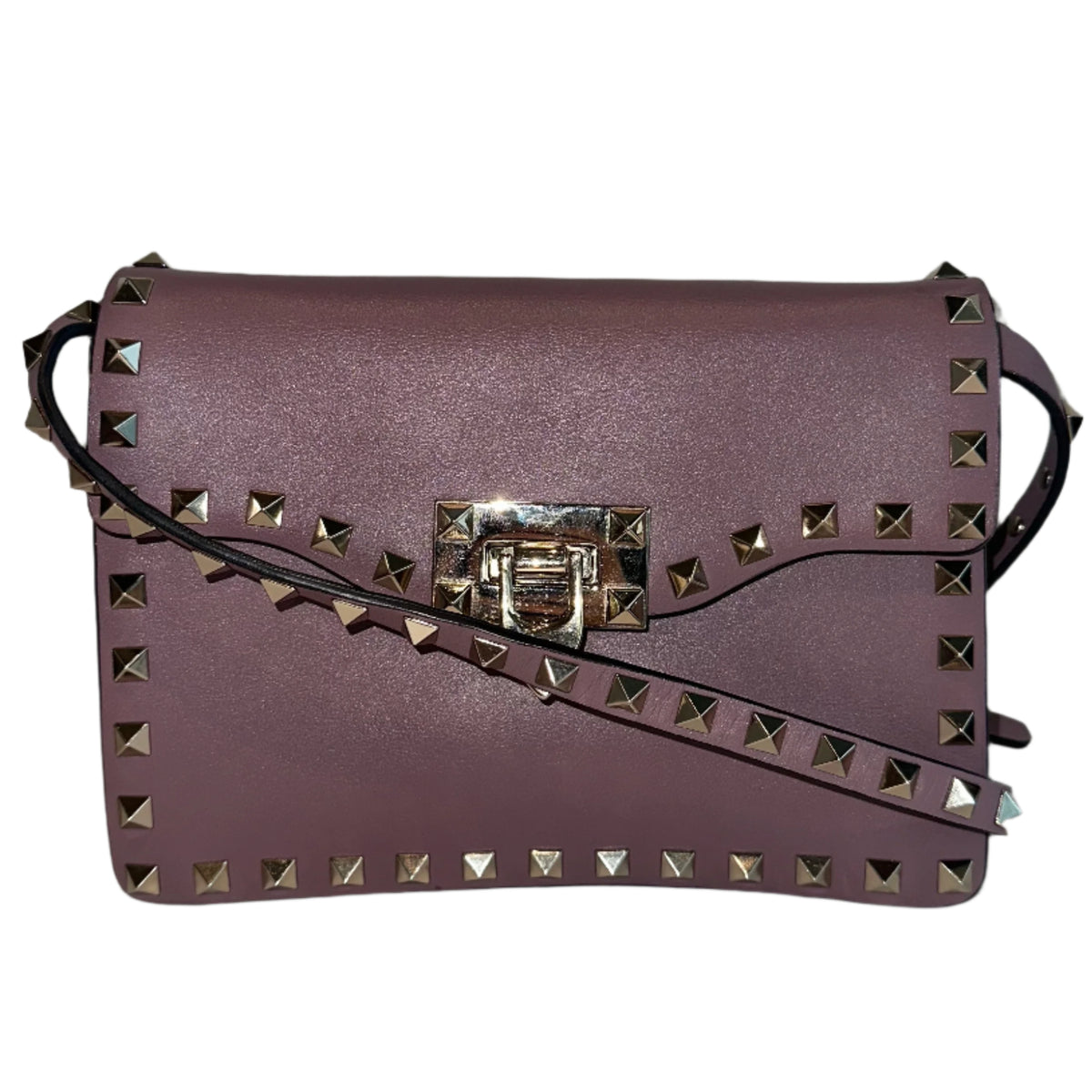 Valentino Flip Lock&nbsp;

Valentino Crossbody Bag

Neutrals Leather

Rockstud Accents

Gold-Toned Hardware

Studded Accents

Suede Lining&nbsp;

Single Interior Pocket&nbsp;