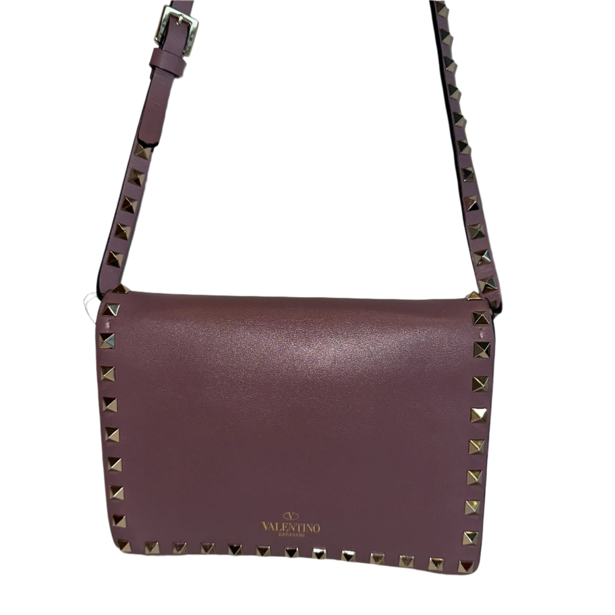 Valentino Flip Lock&nbsp;

Valentino Crossbody Bag

Neutrals Leather

Rockstud Accents

Gold-Toned Hardware

Studded Accents

Suede Lining&nbsp;

Single Interior Pocket&nbsp;