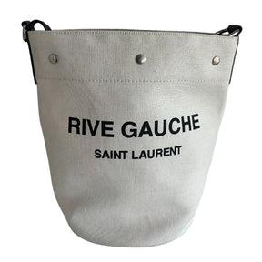 Saint Laurent Rive Gauche Bucket Bag&nbsp;  Off-White Linen&nbsp;  Black Leather Detachable Strap&nbsp;  Black Pouch Included&nbsp;  Snap Closure at Top&nbsp;