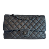 Chanel Medium Double Flap

Grey Leather&nbsp;

Textured Calfskin&nbsp;

Matte Leather&nbsp;

Chain-Link Leather Strap&nbsp;

Chanel CC Turn Lock&nbsp;