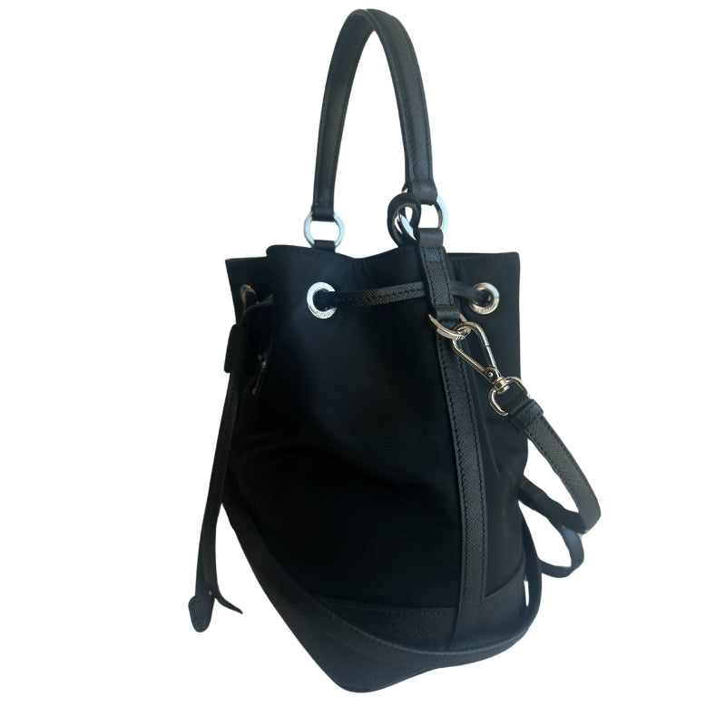 Prada Nylon Bucket Bag&nbsp;

Black&nbsp;

Silver-Toned Hardware

Leather Trim&nbsp;

Flat Handle&nbsp;

Single Adjustabale Strap&nbsp;