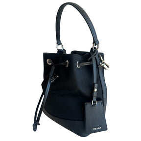 Prada Nylon Bucket Bag&nbsp;

Black&nbsp;

Silver-Toned Hardware

Leather Trim&nbsp;

Flat Handle&nbsp;

Single Adjustabale Strap&nbsp;