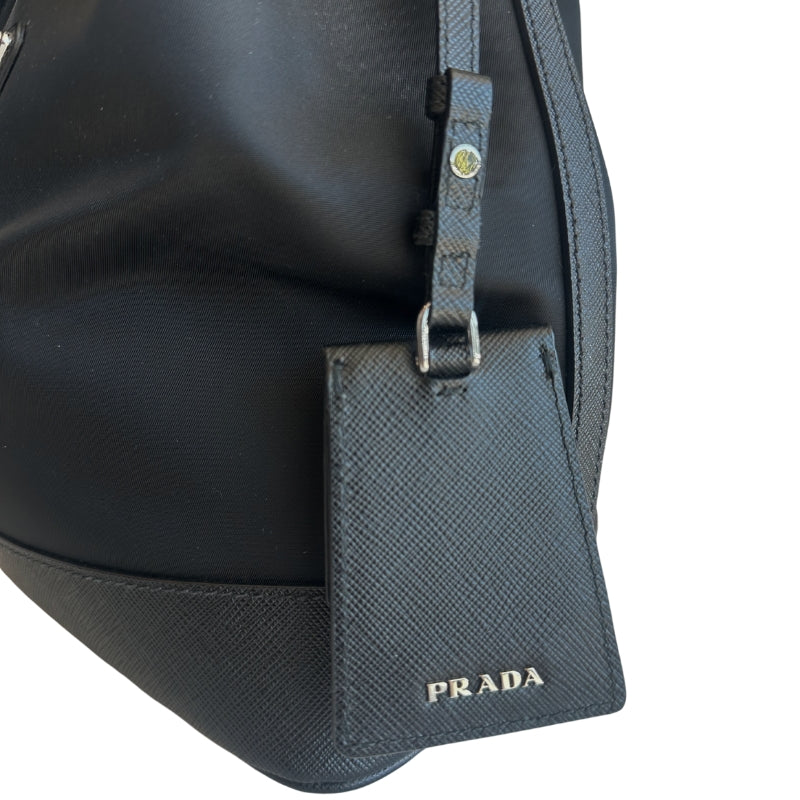 Prada Nylon Bucket Bag&nbsp;

Black&nbsp;

Silver-Toned Hardware

Leather Trim&nbsp;

Flat Handle&nbsp;

Single Adjustabale Strap&nbsp;