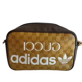 Gucci x Adidas Bag&nbsp;

Yellow&nbsp;

Printed

Antiqued Gold-Toned Hardware

Single Adjustable Shoulder Strap

Leather Trim Embellishment&nbsp;

Canvas Lining&nbsp;

Single Interior Pocket&nbsp;