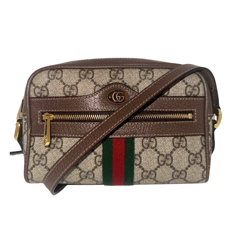 Gucci Ophidea Camera Bag&nbsp;

Gucci Crossbody Bag

GG Subreme&nbsp;

Web Accents&nbsp;

Double G Logo&nbsp;

Brown Leather Embellishments&nbsp;

Suede Lining&nbsp;

Front Zipper Pocket&nbsp;

Zipper Closure&nbsp;