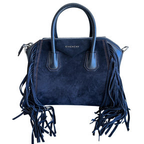 Givenchy Suede Fringe Tote&nbsp;

Navy Suede Exterior

Leather Handles and Sides

Fridge Embellishments on Side

Zipper at Top&nbsp;

Dual Handles&nbsp;