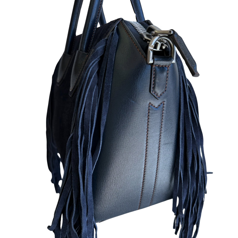 Givenchy Suede Fringe Tote&nbsp;

Navy Suede Exterior

Leather Handles and Sides

Fridge Embellishments on Side

Zipper at Top&nbsp;

Dual Handles&nbsp;