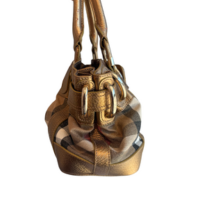 A vintage Burberry-style handbag in metallic gold leather with the classic beige, black, and white check pattern on the lower body, featuring gold-tone hardware and double shoulder straps, shown against a plain white background.