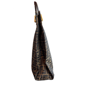 Left side of brown Fendi Zucca FF Canvas Tote on a white background. 