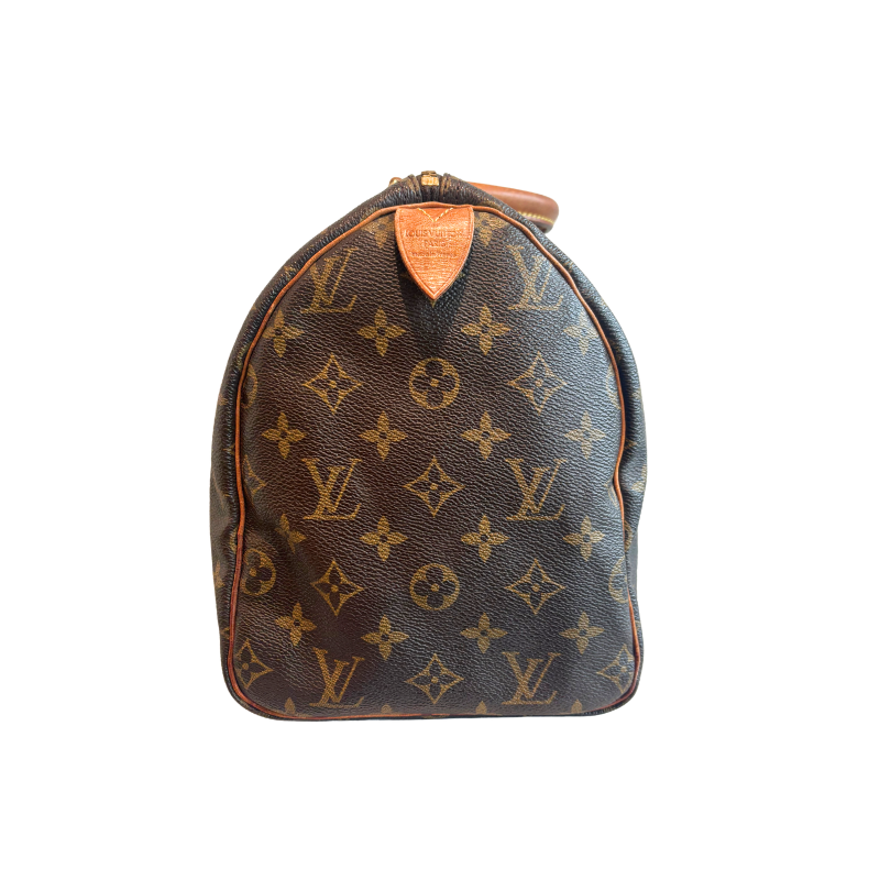 Left Side of Louis Vuitton Monogram Speedy 30 Boston Bag on a White Background. 