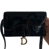 Dior Patent Leather Waist Bag&nbsp;

Black Patent Leather

Saddle Rectangular&nbsp;

Belt Bag

Adjustable Strap

Snap Magnetic Closure&nbsp;

D Embellisment Charm&nbsp;