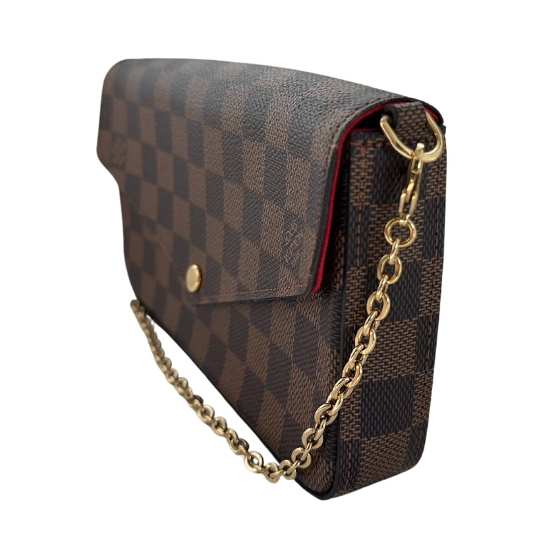 Louis Vuitton Felecie Pochette&nbsp;

Louis Vuitton Shoulder Bag

Brown Coated Canvas

Damier Ebene Pattern

Brass Hardware

Chain-Link Shoulder Strap&nbsp;

Canvas Lining&nbsp;

Detatchable Interior Pouch and Cardholder&nbsp;