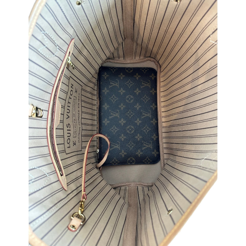 Louis Vuitton Neverfull MM&nbsp;  Pouch Included&nbsp;  Neautral Coated Canas  LV Monogram Canvas  Gold-Toned Hardware  Leather Trim&nbsp;  Dual Shoulder Straps  Clasp Closure at Top&nbsp;