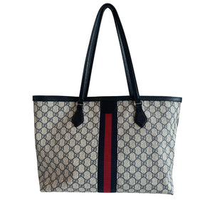 Gucci Meidum Ophedia Bag&nbsp;  Navy and Tan Canvas  GG Supreme Print Canvas  Dual Straps&nbsp;  Leather Trim&nbsp;  Magnetic Closure at Top&nbsp;  Canvas Interior&nbsp;