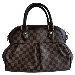 Louis Vuitton Trevi DB&nbsp;  Louis Vuitton Damier Coated Canvas  Brown Canvas  Gold-Toned Hardware  Rolled Handles  Brown Cowhide Leather Trim&nbsp;  Optional Shoulder Strap&nbsp;