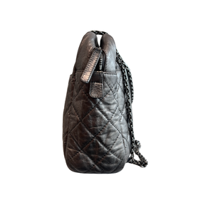 Right SIde of Chanel Quilted Calfskin Leather Medium Reissue Camera Bag on a white background. 