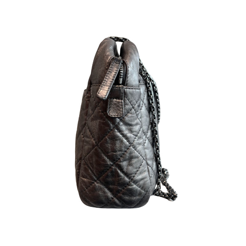 Right SIde of Chanel Quilted Calfskin Leather Medium Reissue Camera Bag on a white background. 